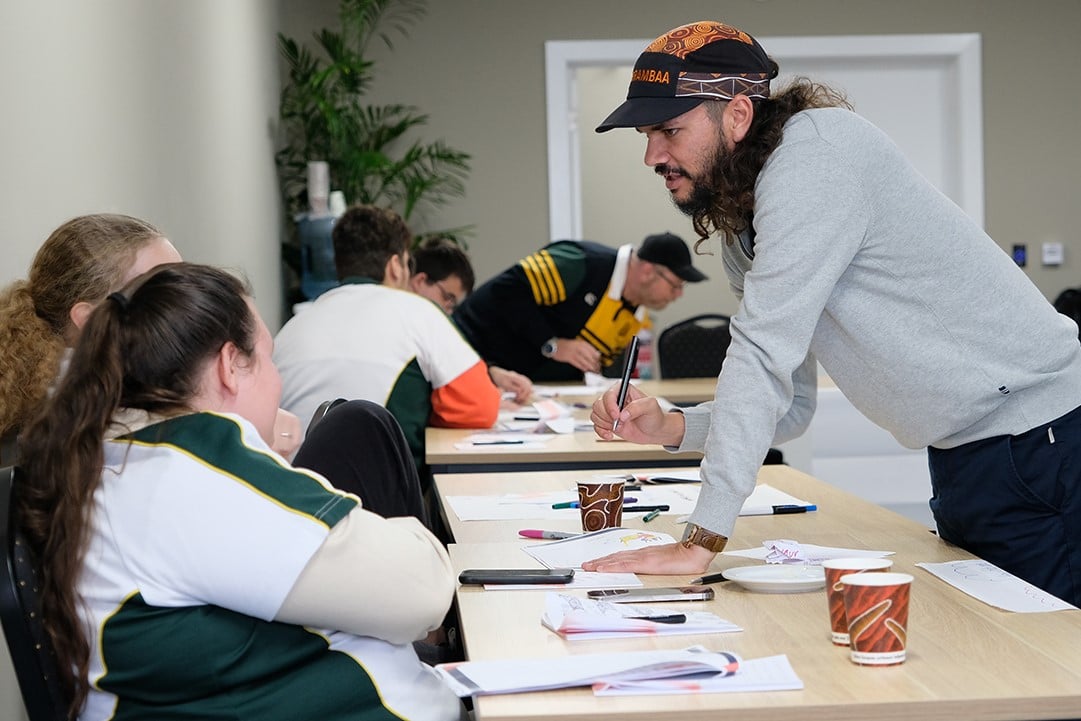 facilitator talking to students